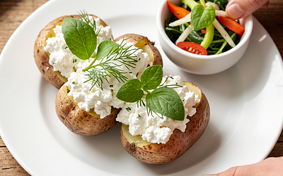 Baked potatoes stuffed with cottage cheese and dill