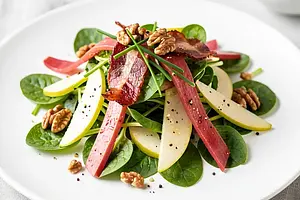 Sorrel with apple and smoked bacon on young lettuce leaves