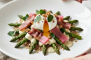 Asparagus salad with smoked bacon and poached egg