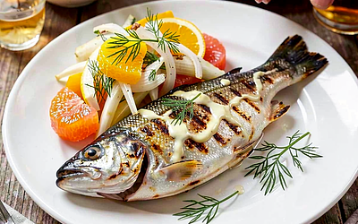 Grilled trout Krakow style with fennel and citrus salad