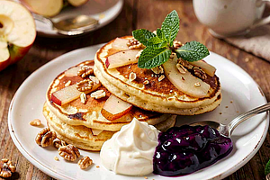 Apple and Cinnamon Pancakes Served with Mascarpone Cream and Blueberry Jam