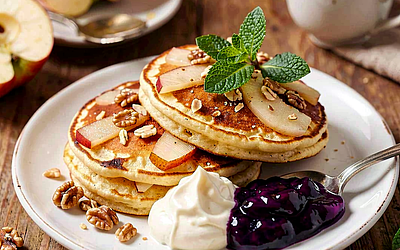 Apple and Cinnamon Pancakes Served with Mascarpone Cream and Blueberry Jam