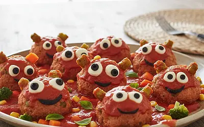 Colorful Turkey and Vegetable Monsters in Tomato Sauce