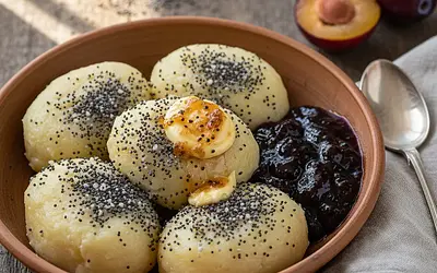 Creamy potato dumplings with poppy seeds, plum jam, and browned butter