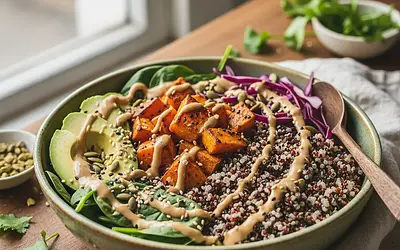 Buddha Bowl of Power with Roasted Sweet Potato, Quinoa, and Peanut Tahini Sauce