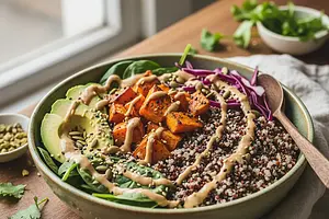 Buddha Bowl of Power with Roasted Sweet Potato, Quinoa, and Peanut Tahini Sauce