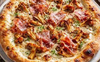White Pizza with Chanterelles, Parma Ham, and Truffle Oil