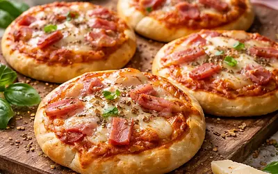 Mini pizzas with cheese and ham