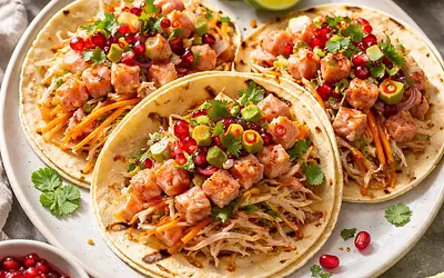 Quick fusion tacos with salmon 'ceviche', kimchi coleslaw, and pomegranate salsa