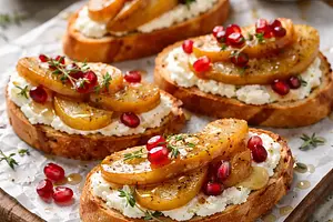 Quick crostini with ricotta, caramelized pear, and pomegranate seeds