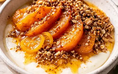 Coconut-vanilla cream with baked persimmon, kumquat-ginger sauce, and crunchy tahini praline (fusion) - variant cd7b4c84