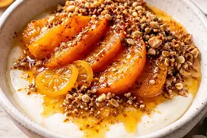 Coconut-vanilla cream with baked persimmon, kumquat-ginger sauce, and crunchy tahini praline (fusion) - variant cd7b4c84