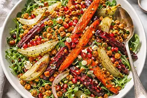 Modern winter salad with roasted carrots, fennel, pomegranate, and crispy chickpeas