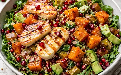 Fusion salad with roasted butternut squash, quinoa, halloumi, and pomegranate