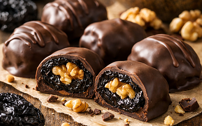 Dried plums in chocolate with walnuts