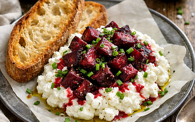 Street-style cottage cheese with roasted beets, chives, and sourdough bread