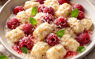 Dumplings with cheese and raspberries