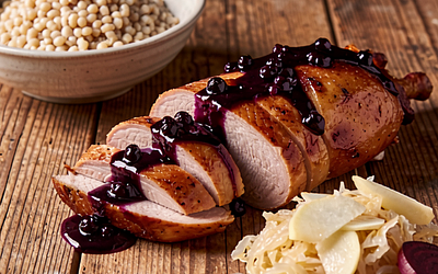 Duck with blackcurrant sauce, spelt and braised sauerkraut