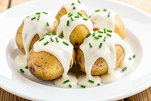 Potatoes in their skins with garlic sauce